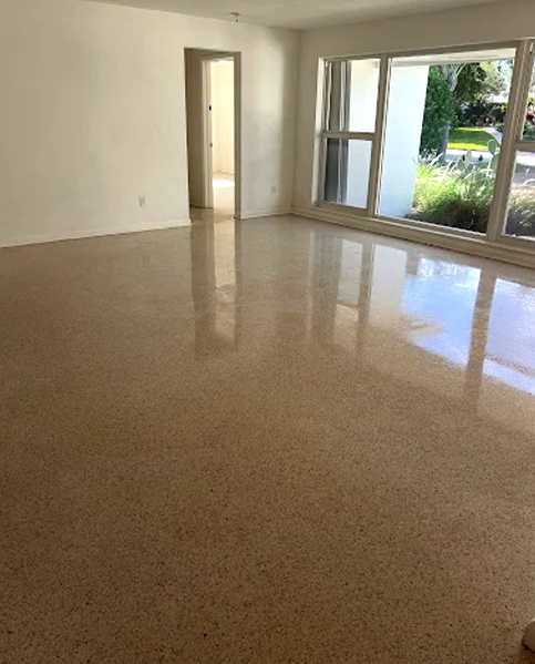 Technician diamond-polishing a terrazzo floor