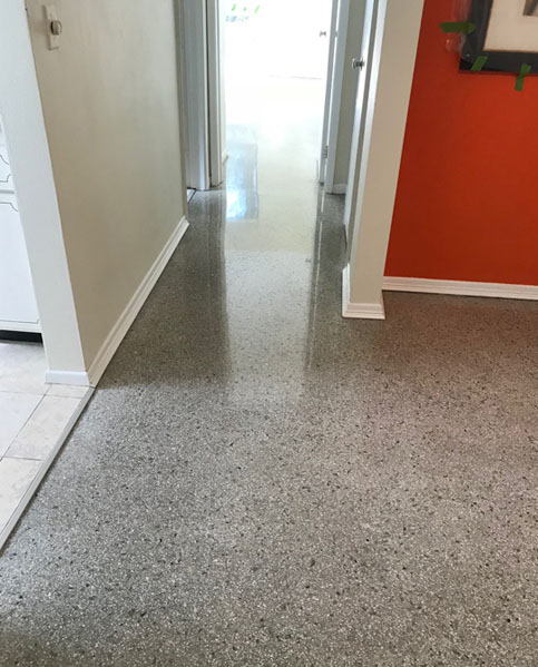 Polished terrazzo floor restored to a mirror shine
